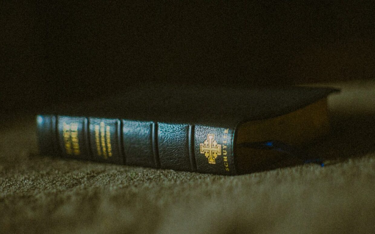 A book sitting on top of a carpet covered floor