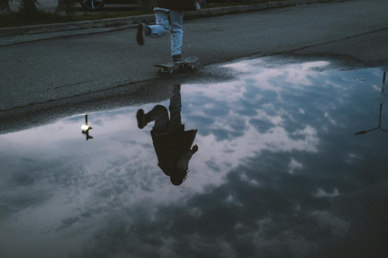 skater s reflection on water